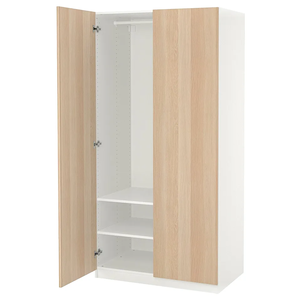 An open IKEA PAX wardrobe in white and light wood. It has two adjustable shelves inside.