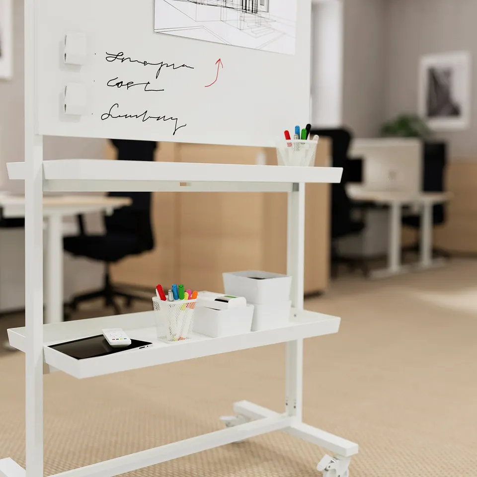Whiteboard on wheels with shelves, holding markers, and a tablet.