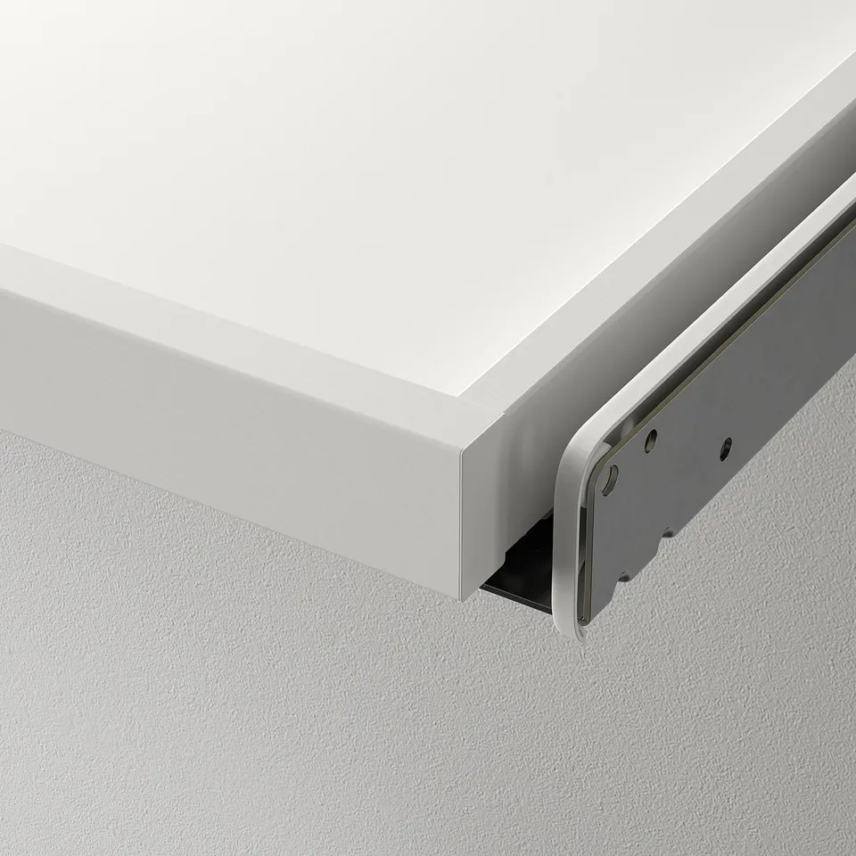A close-up of a drawer accessory with a smooth, white finish, securely attached to a metal slide mechanism ensuring durability and silent operation.