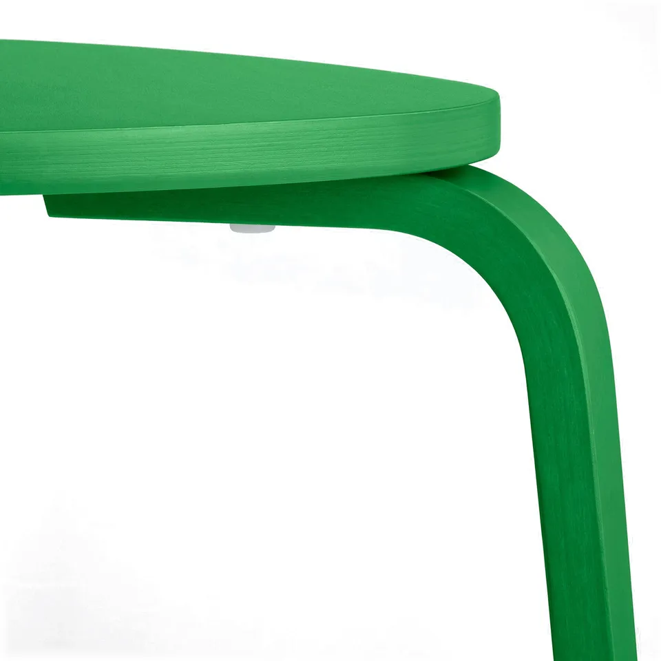 Bright green, sturdy wooden stool, showcasing smooth finish and stable three-legged design.