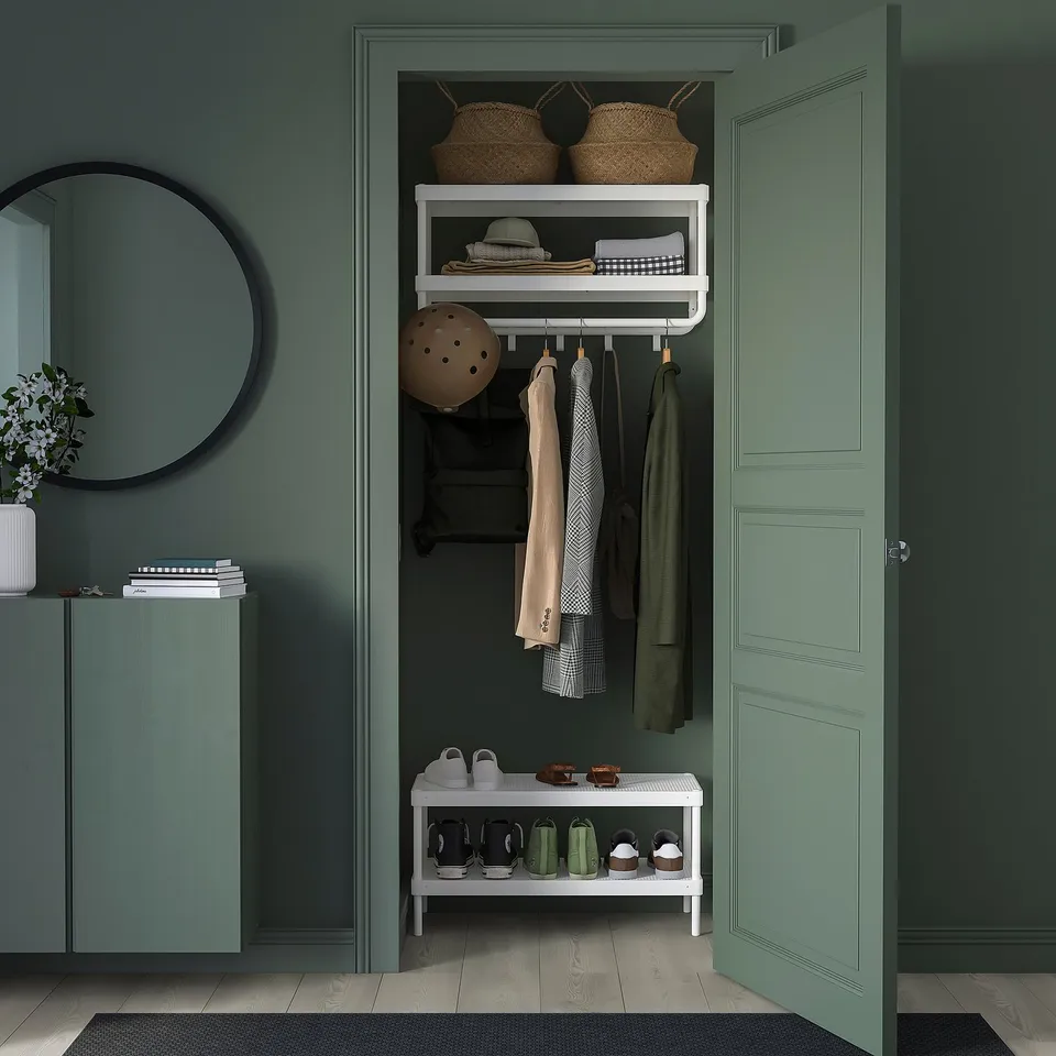 MACKAPÄR entryway organiser, white, steel. Shelves hold baskets, folded clothes; hooks hang coats. Fits compact spaces, neat design.