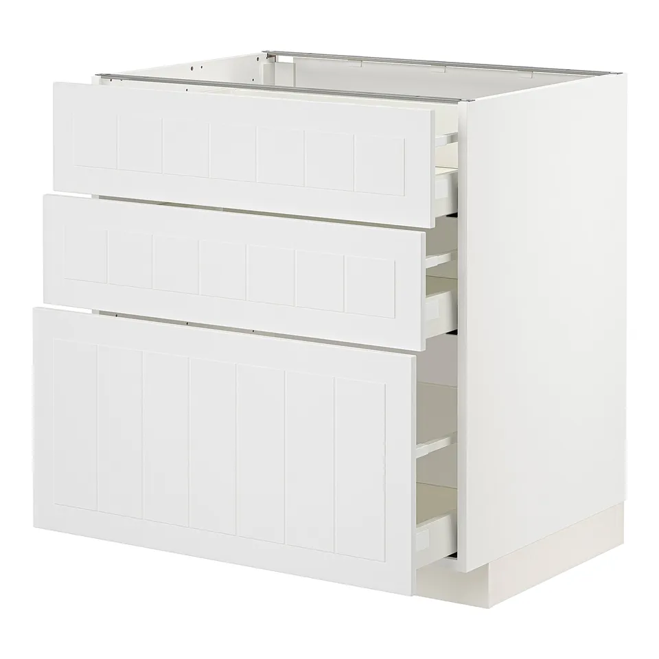 A white METOD kitchen cabinet with three drawers. It a modern design with a light finish and vertical grooves.