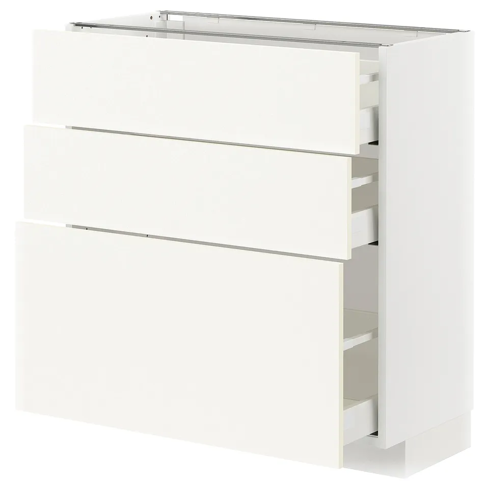 A white METOD kitchen cabinet with drawers. It a sleek design with a sturdy frame, providing ample storage space.
