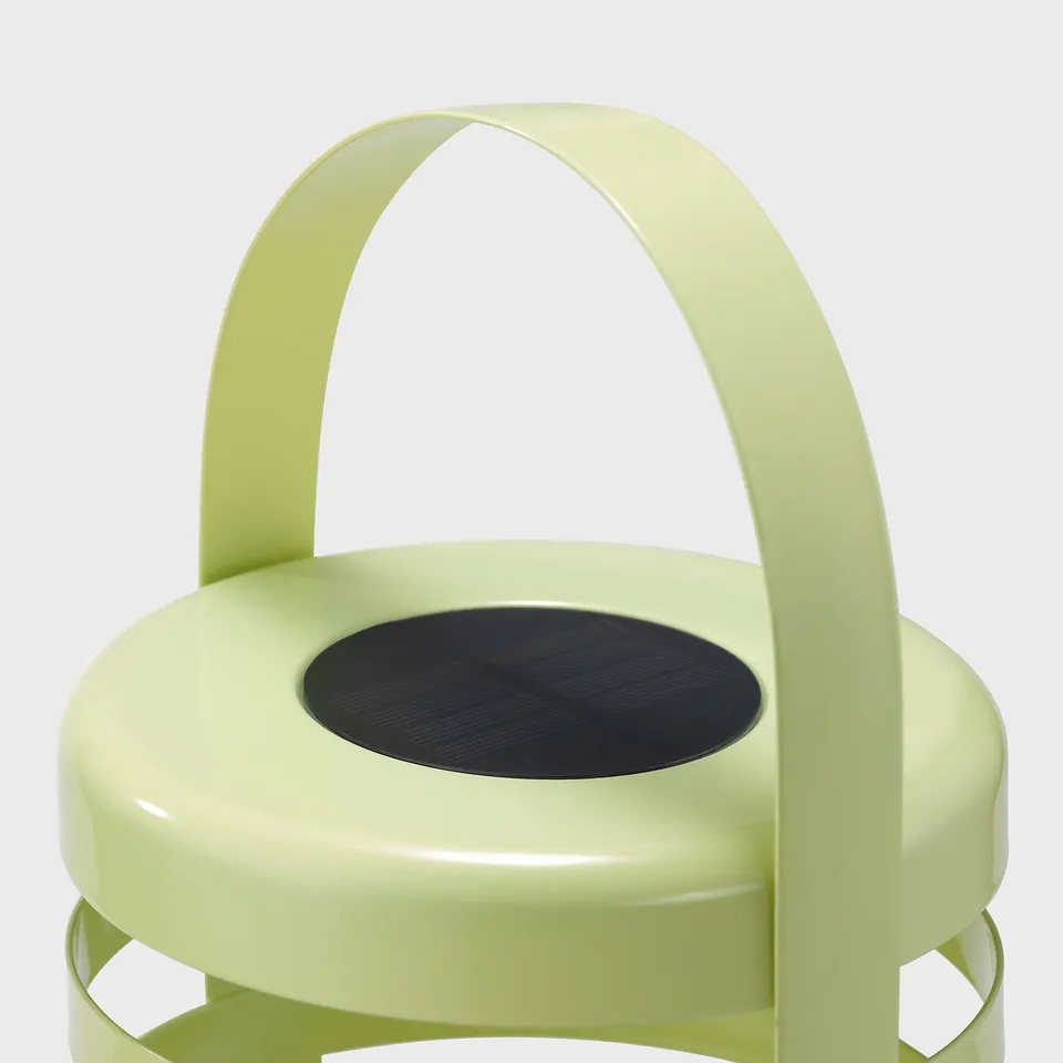 Modern, sleek, green watering can with black handle, durable, high-quality materials.