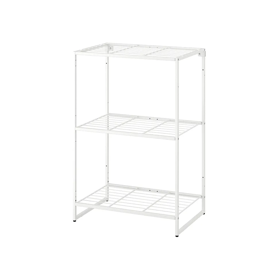 A white JOSTEIN storage unit with three open shelves made of metal, suitable for both indoor and outdoor use due to its rust-resistant coating.