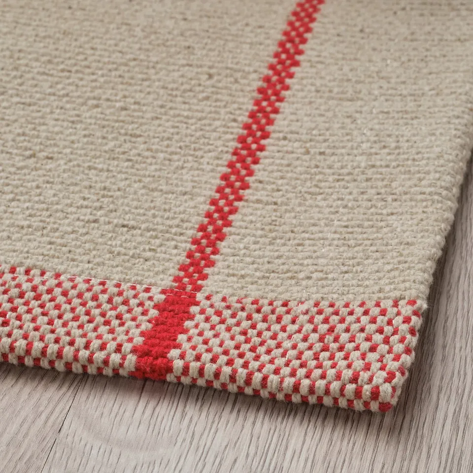 Soft cotton rug, off-white with red stripe pattern. Flatweave design, perfect for under dining tables.