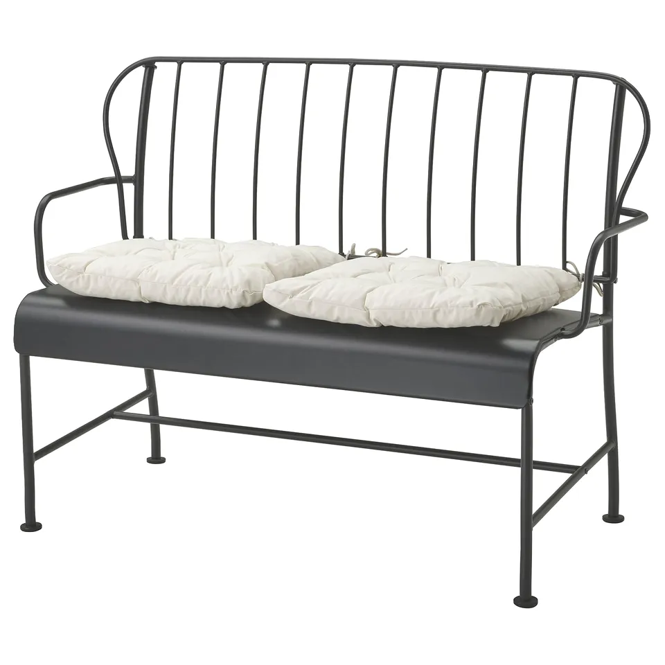 Modern outdoor grey metal bench with white cushions, sleek design, metal frame.