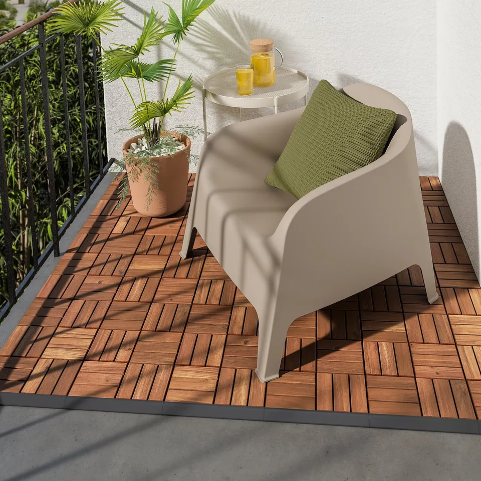 Modern wooden balcony with beige RUNNEN edging, green cushion, and plants.
