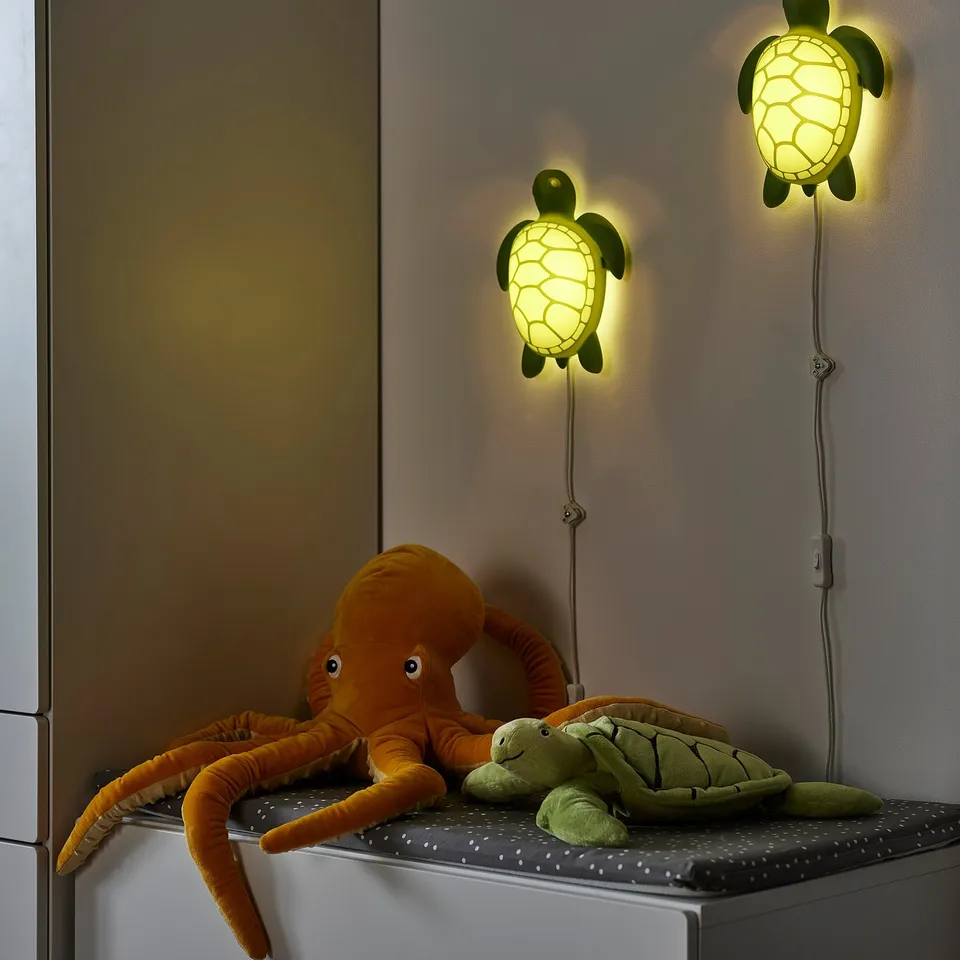 Turtle lamps light plush toys in kids room.