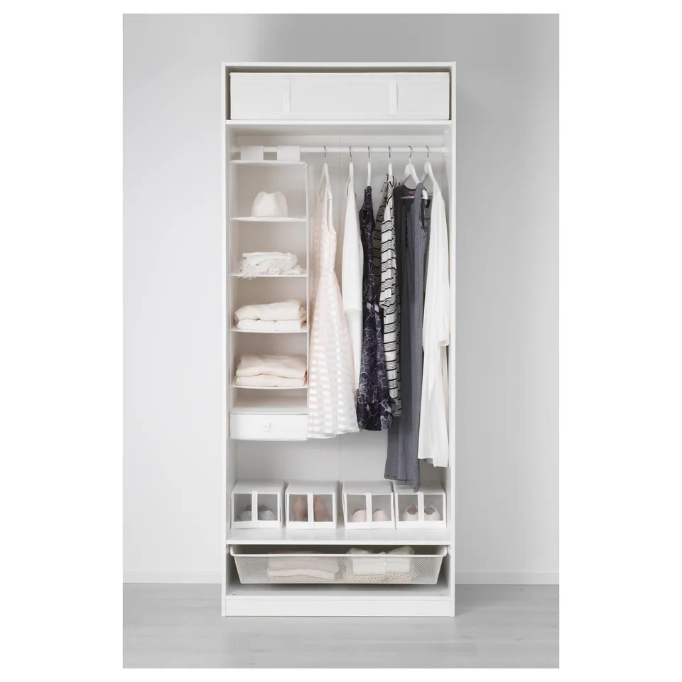 A white, open wardrobe with clothes on hangers, folded clothes, and storage drawers. The design includes shelves and clear organisers.