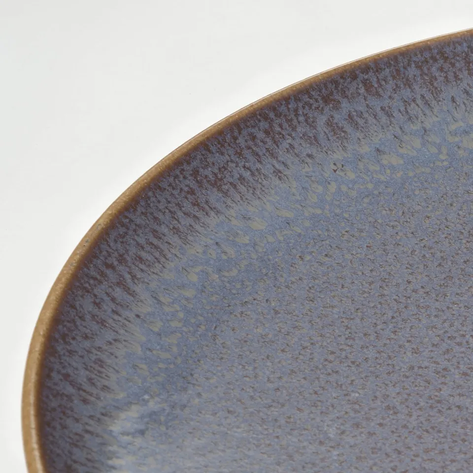 Blue plate with textured glaze.