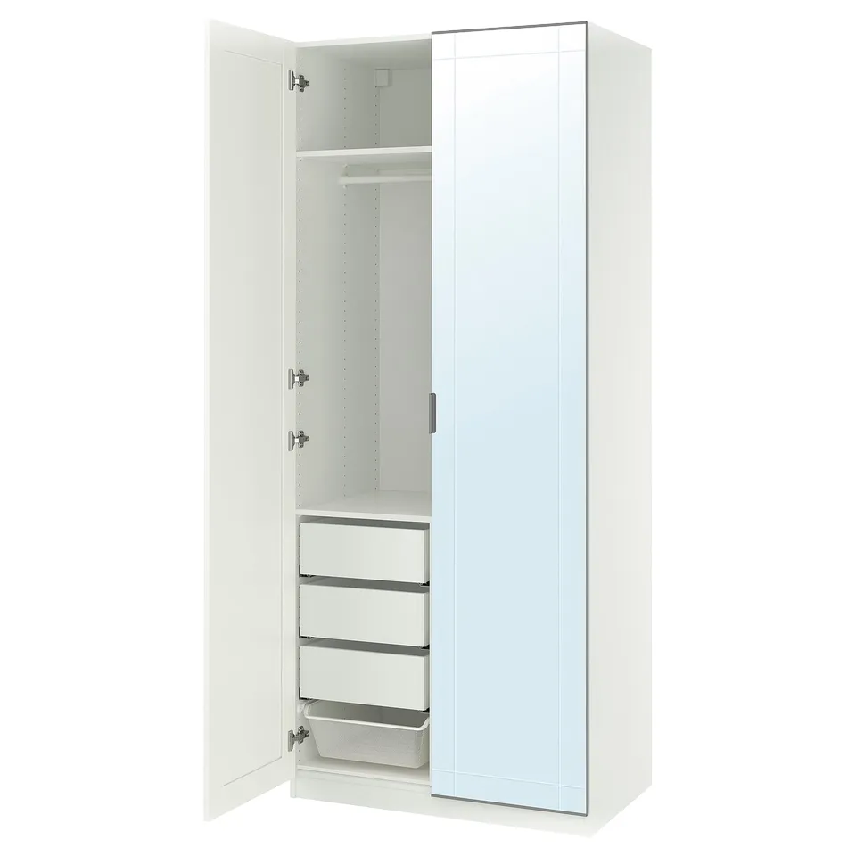 A white PAX wardrobe with one open door revealing shelves and drawers.