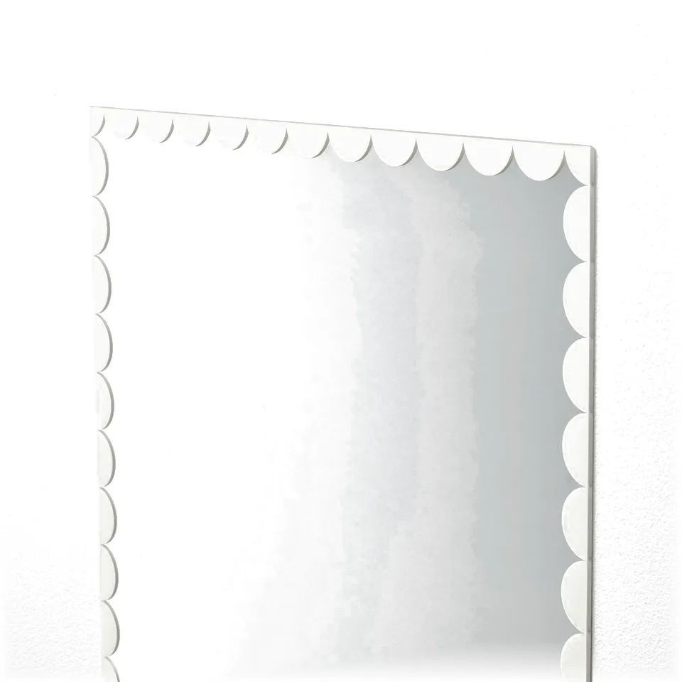Rectangular mirror with scalloped edge, clean wall mount.