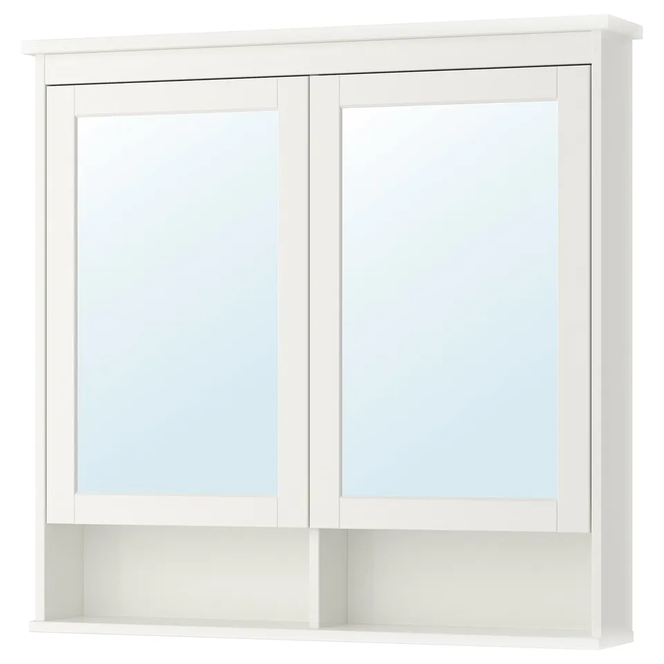 White HEMNES mirror cabinet with two doors and adjustable shelves.