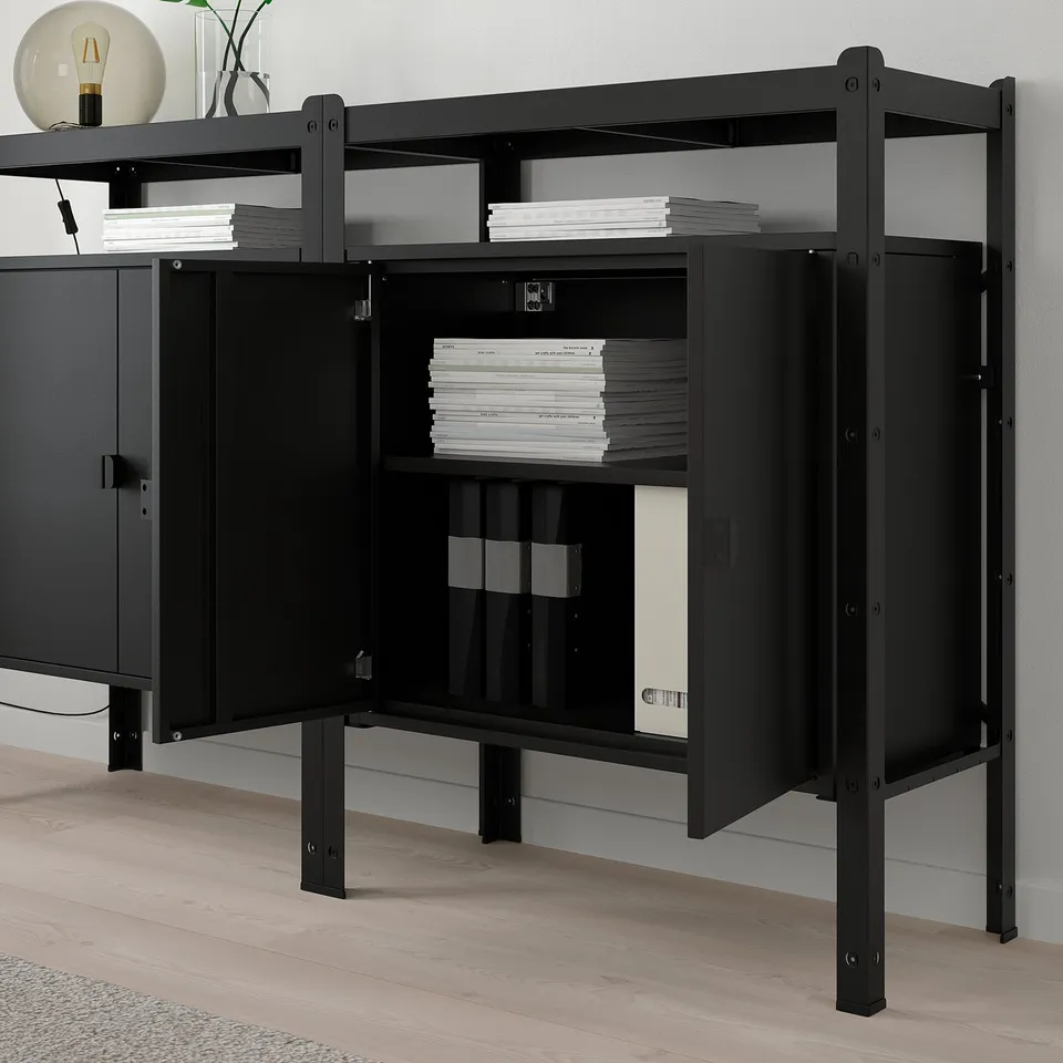 Black metal storage unit with shelves holding stacks of files, designed for heavy loads and easy assembly.