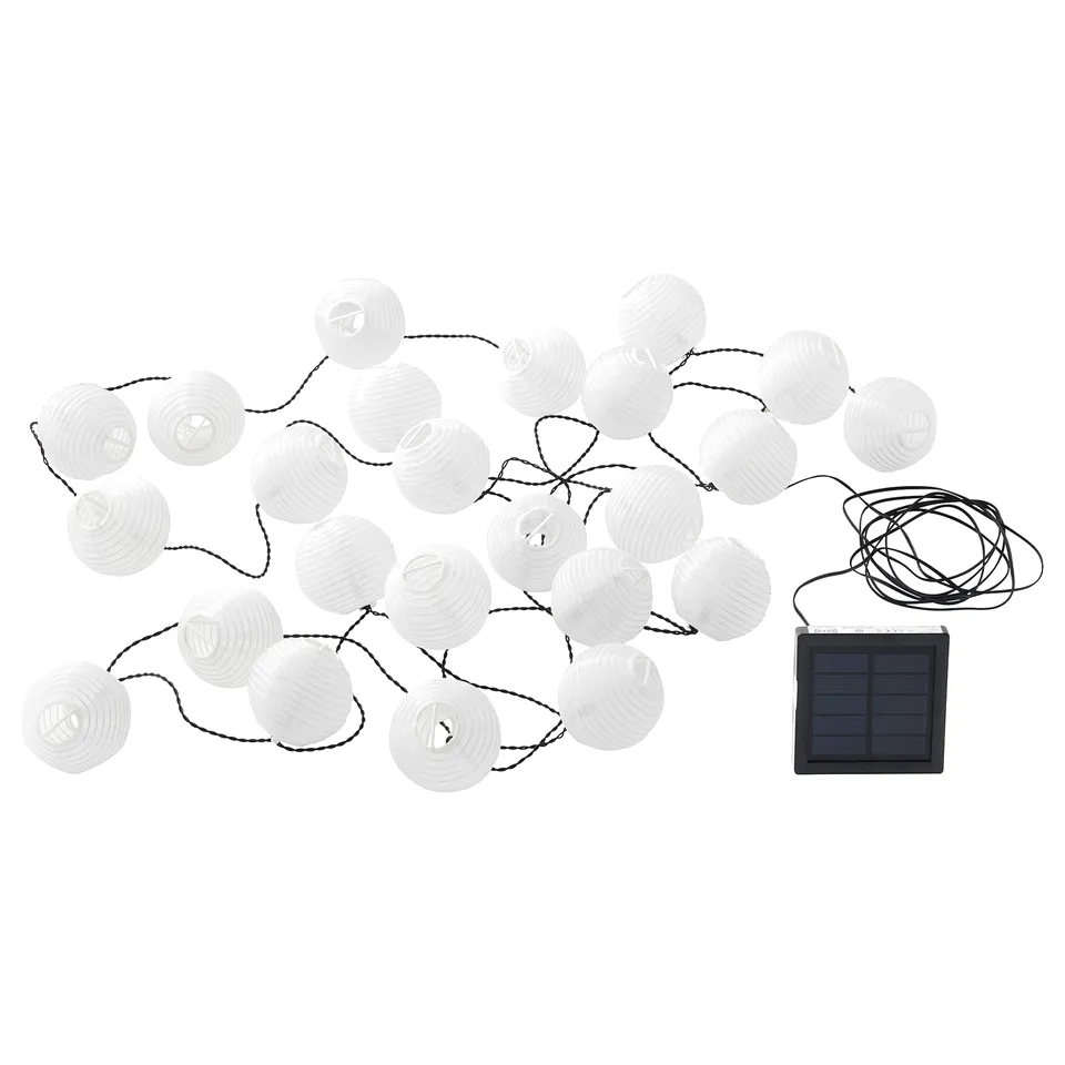 String of 30 white solar-powered lanterns, connected with black wires, featuring a solar panel for charging. Perfect for outdoor decoration.