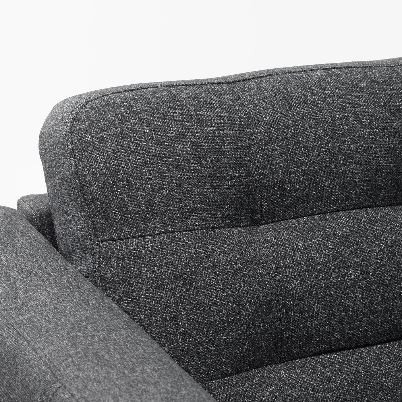 Dark grey modern sofa with plush cushions.