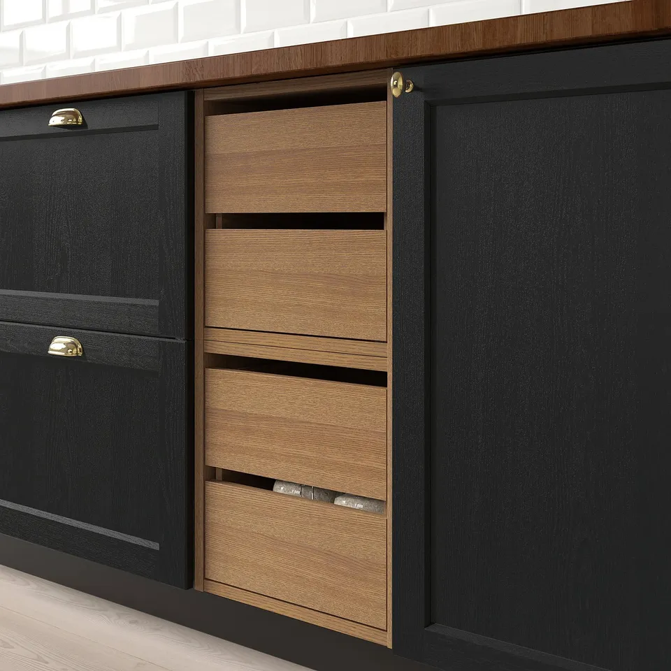 Modern kitchen unit with two pull-out drawers, showing smooth, organised storage solution.