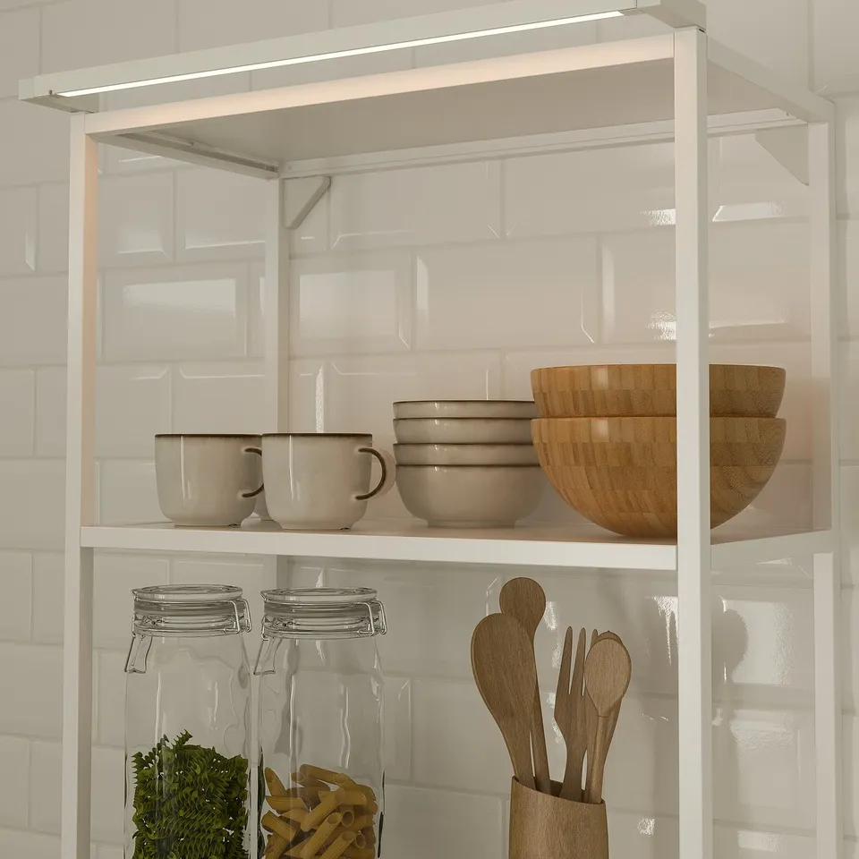 Kitchen shelf with SKYDRAG led light, bowls, cups, jars, and utensils.