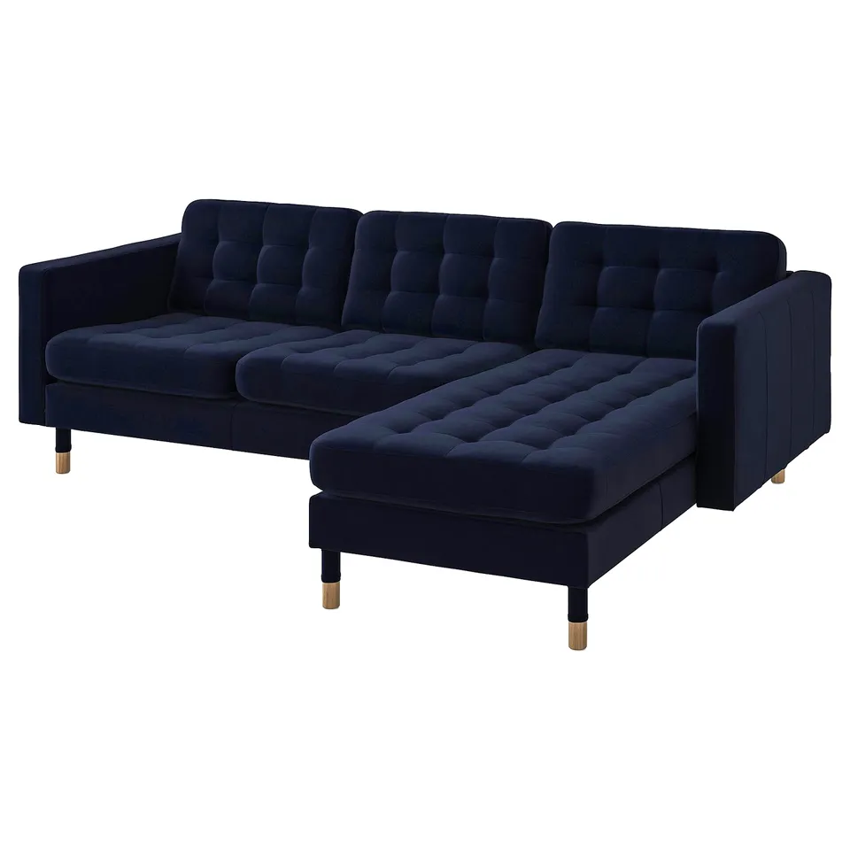 Deep blue velvet l-shaped sofa with brass legs, featuring plush tufted cushions for comfort.