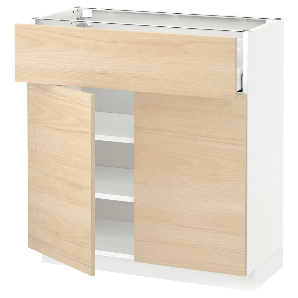 This image shows an ikea METOD kitchen cabinet in light ash wood with a white base. The cabinet has two large doors and a top area.
