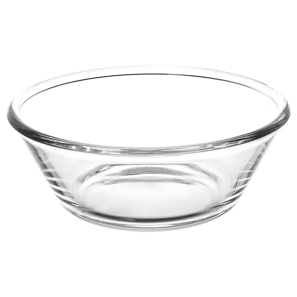 A clear glass bowl named VARDAGEN, with a simple and round design, perfect for serving food.
