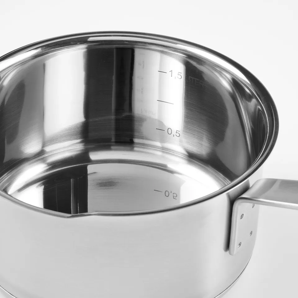 Stainless steel saucepan with measurements inside, sturdy handle, quality design.
