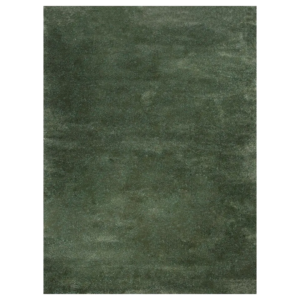 A STOENSE rug in green. Its soft, rectangular, with a thick pile and a subtle sheen.