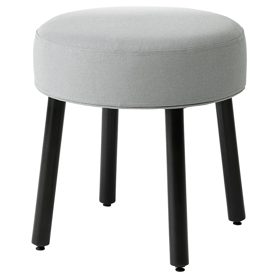 A round, grey MÖRTFORS stool with black metal legs.