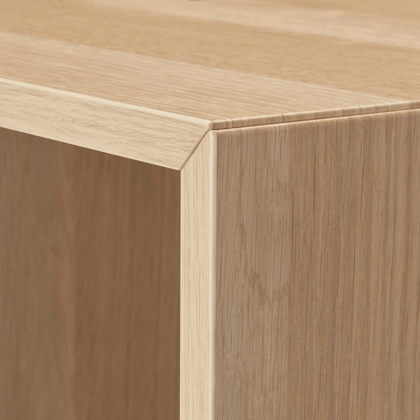 Precision-made wooden furniture corner, smooth finish, fine grain detail.