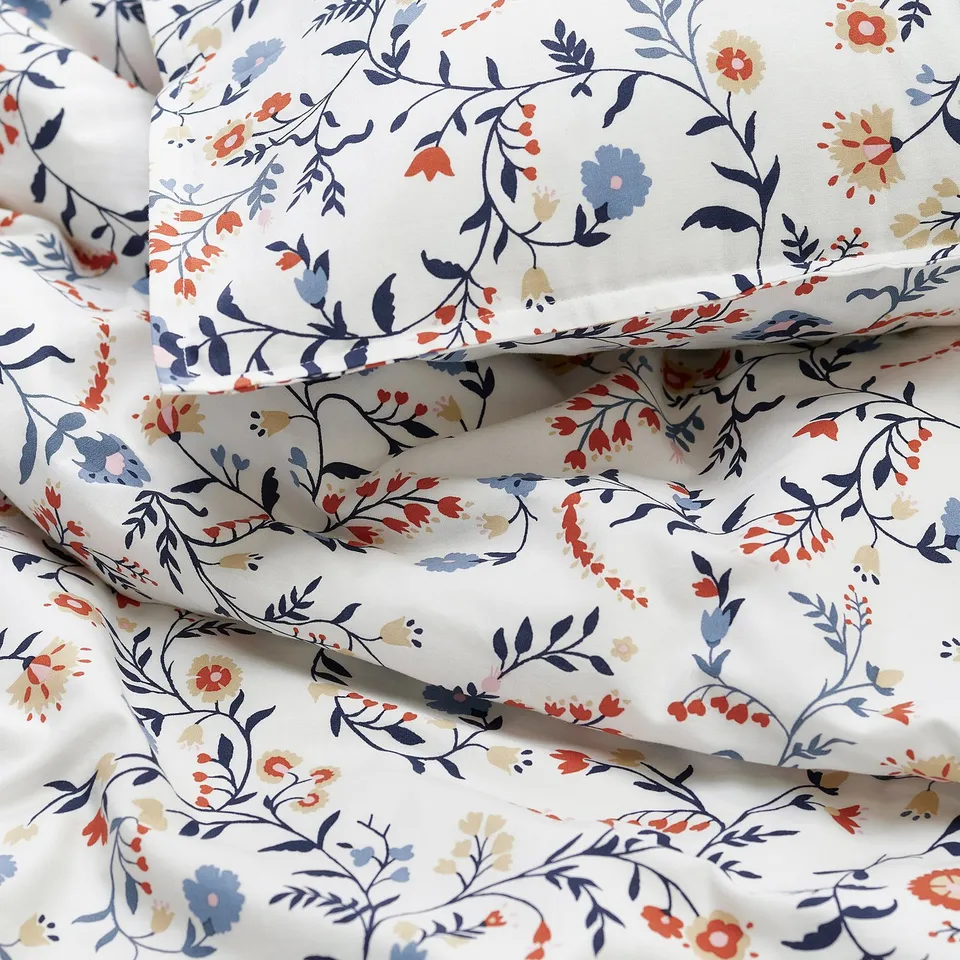 Floral bedding, soft organic cotton, durable stitching, delicate wildflower print.
