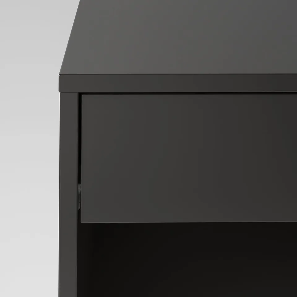 Modern black furniture with sleek, smooth surfaces and neat finishing. Silent, soft-close drawer highlighted.