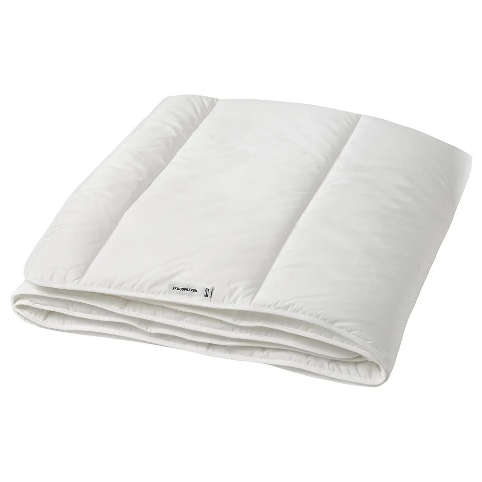 Folded white bed comforter, smooth fabric, rectangular shape, simple design.