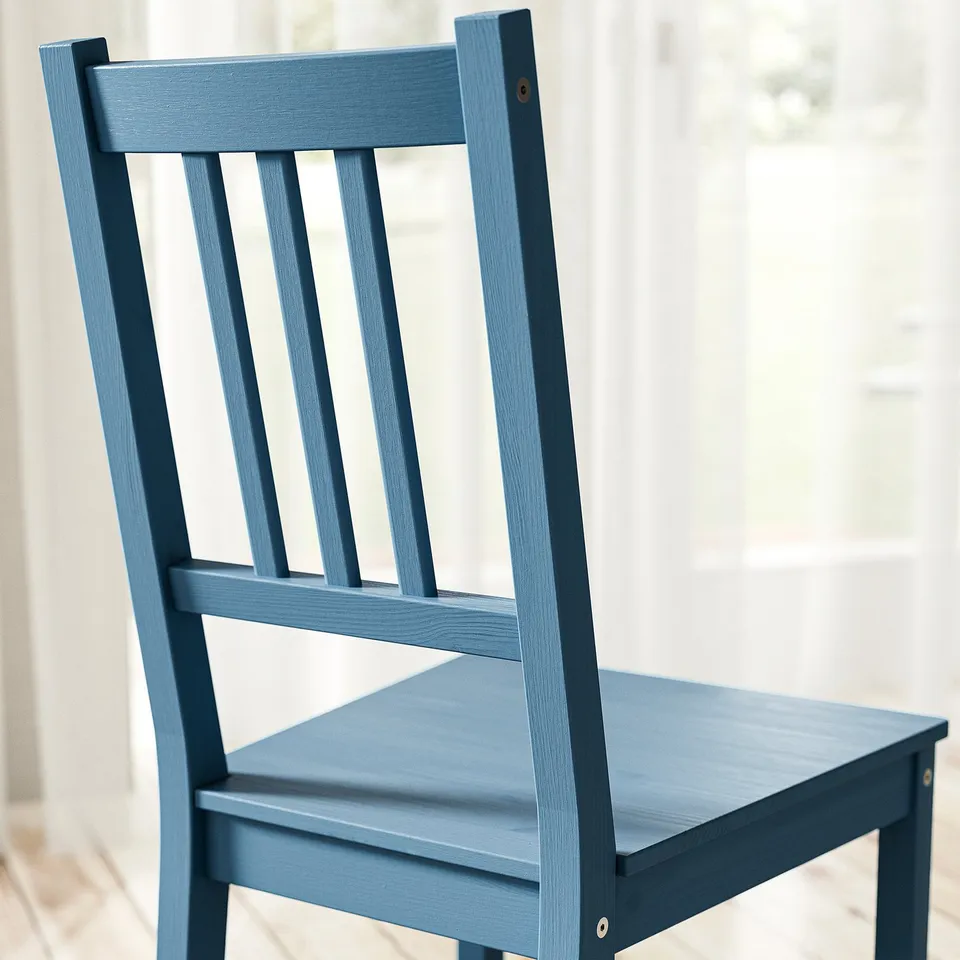 Blue wooden chair, sturdy solid pine construction, smooth finish, simple yet elegant design.