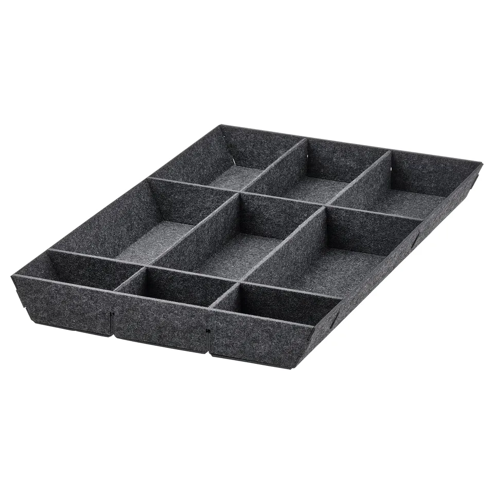 Black UPPDATERA drawer organiser with adjustable compartments.