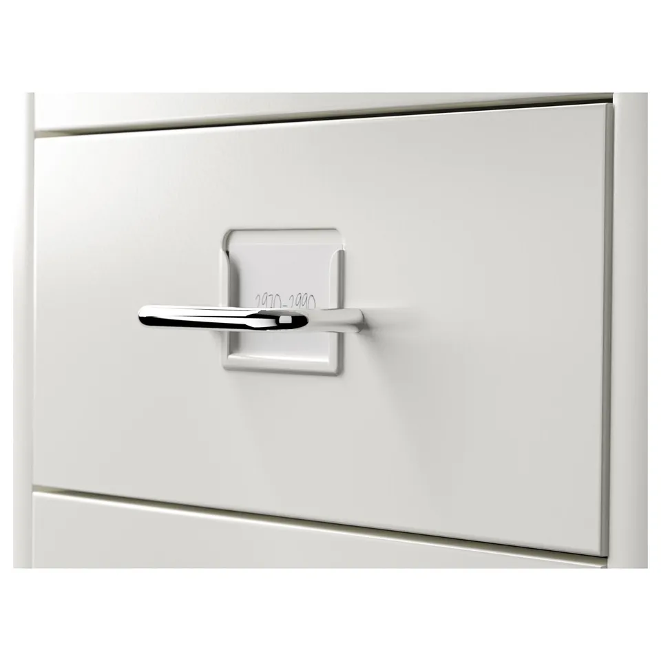 White metal drawer unit with sleek handle, featuring castors for mobility. Elegant and functional design.