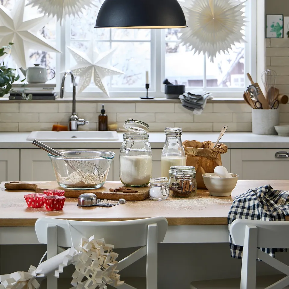 Kitchen counter with baking supplies and star decorations.