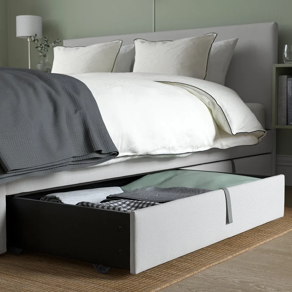 Modern bed with storage and soft headboard.