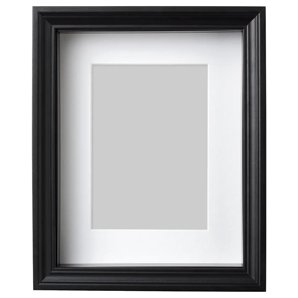 Black VÄSTANHED picture frame with white mat, rectangular, simple design.