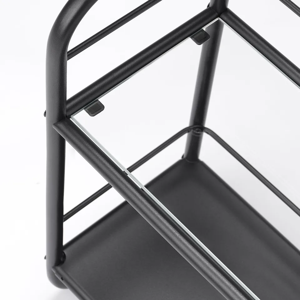 Black metal bathroom shelf with glass top, robust design.