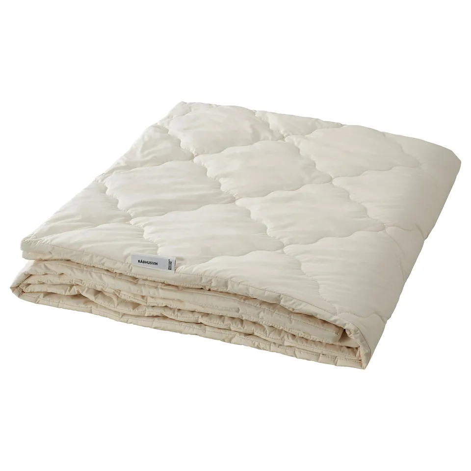 RÅDHUSVIN off-white duvet, natural material, folded, diamond quilting pattern.