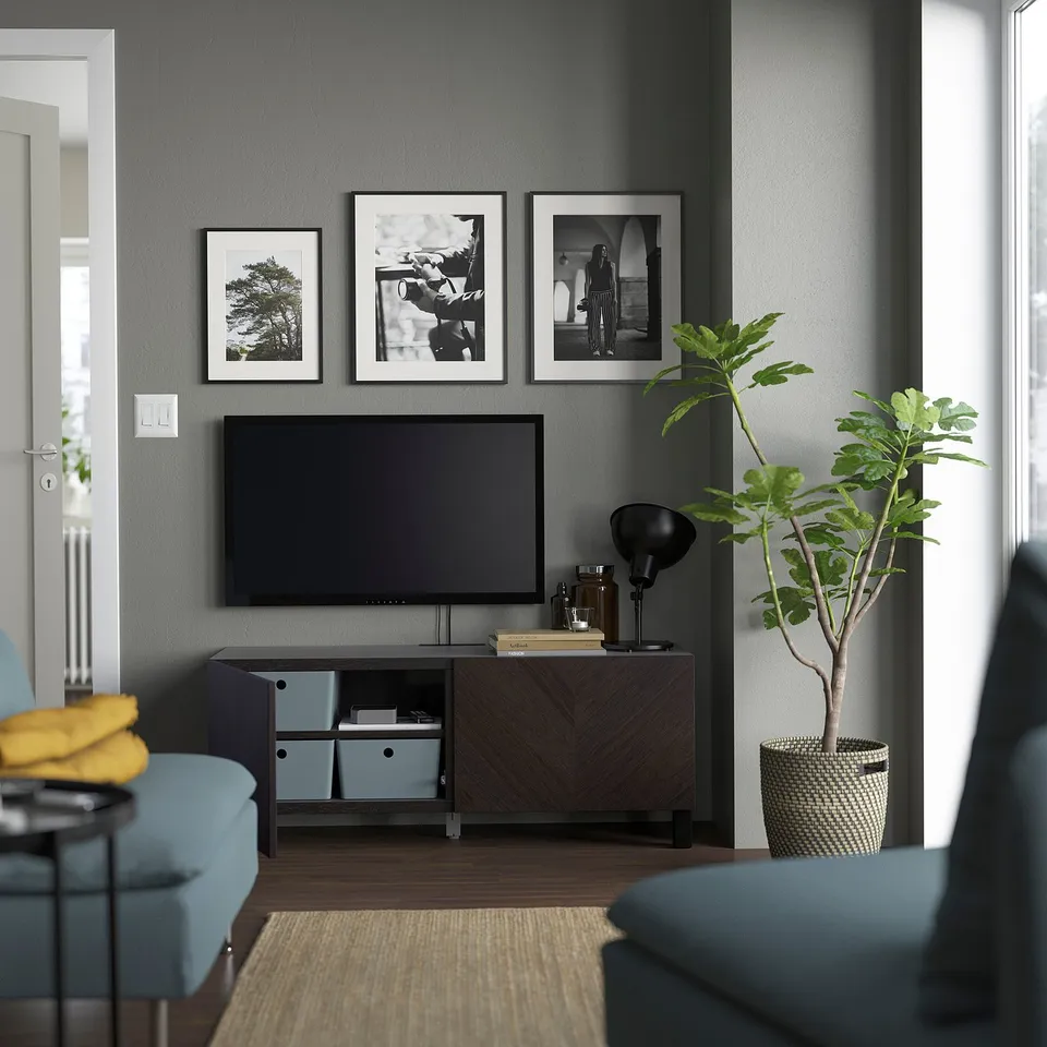Modern living room with BESTÅ tv console, greenery, and cosy decor.