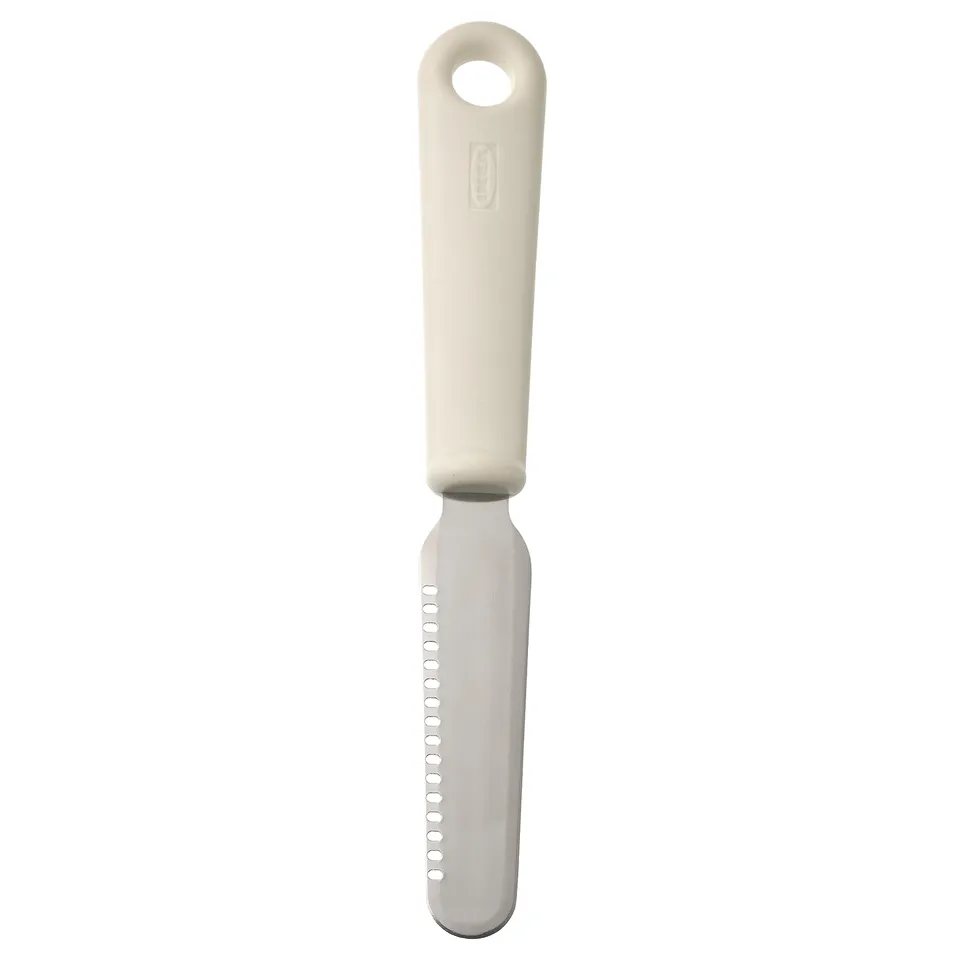 A white UPPFYLLD kitchen spreader with a round handle and a stainless steel blade for versatile kitchen tasks.