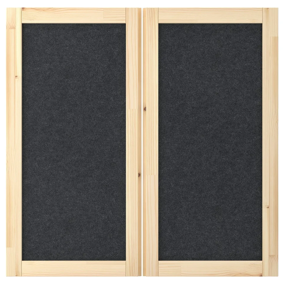 IVAR storage unit with two wooden-framed black felt doors. Simple, elegant, and functional design for organising items and displaying notes.