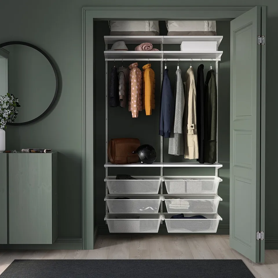 Open wardrobe with white BOAXEL storage system. Holds clothes, bags, and accessories. Fit for small spaces, organised and modern in design.