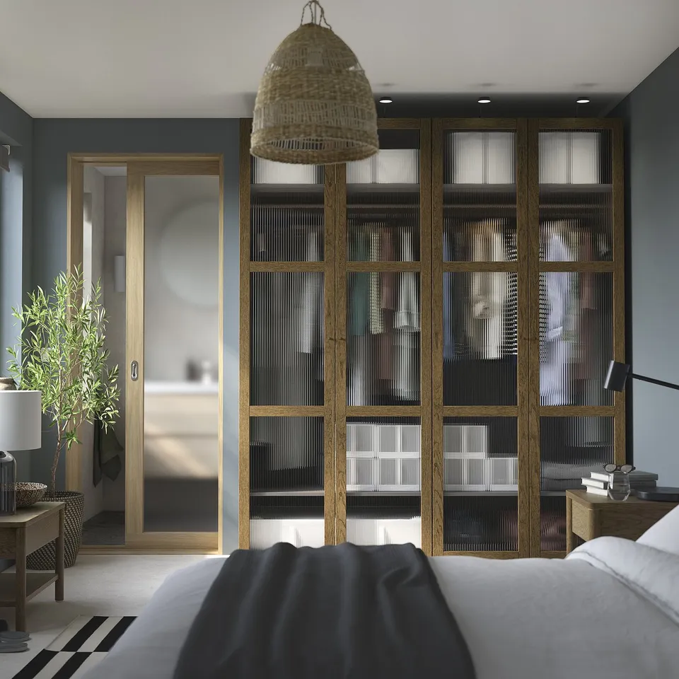 Modern bedroom with TONSTAD wardrobe, dark grey walls, white bed, pendant light, glass doors, plant, lamp