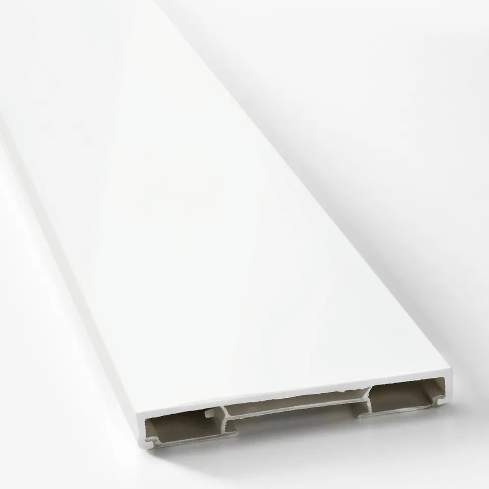 White, glossy, rectangular plastic plinth or trim piece. Smooth, even surface with clean edges, designed for kitchen cabinet installation.