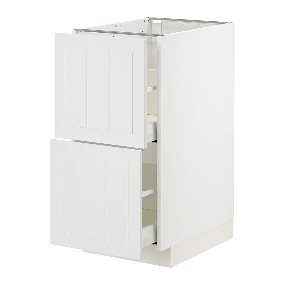 White METOD kitchen cabinet with two open drawers and a door.