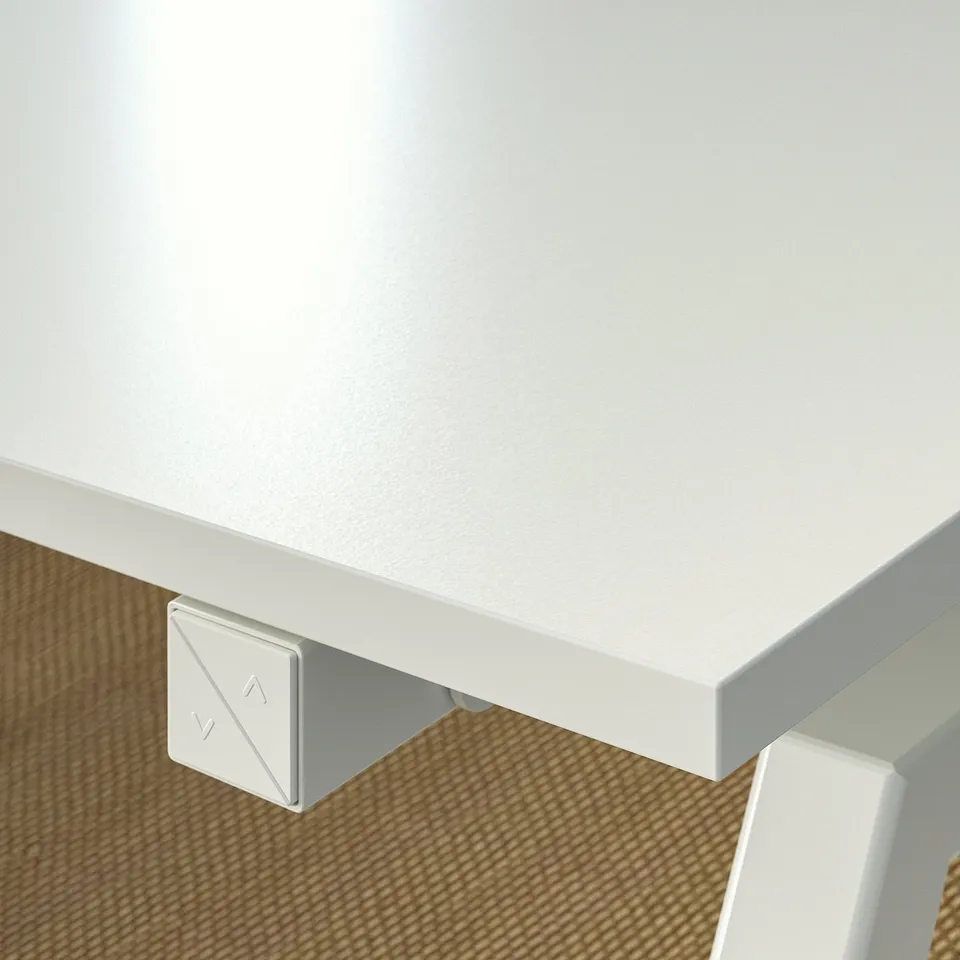 White sit/stand desk corner, sleek design, smooth edge, modern feel.