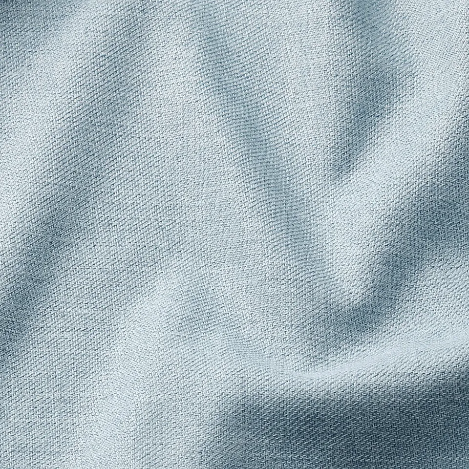 Close-up of a soft, luxurious, textured fabric with a subtle melange effect, showcasing its high-quality weave and recycled polyester composition.
